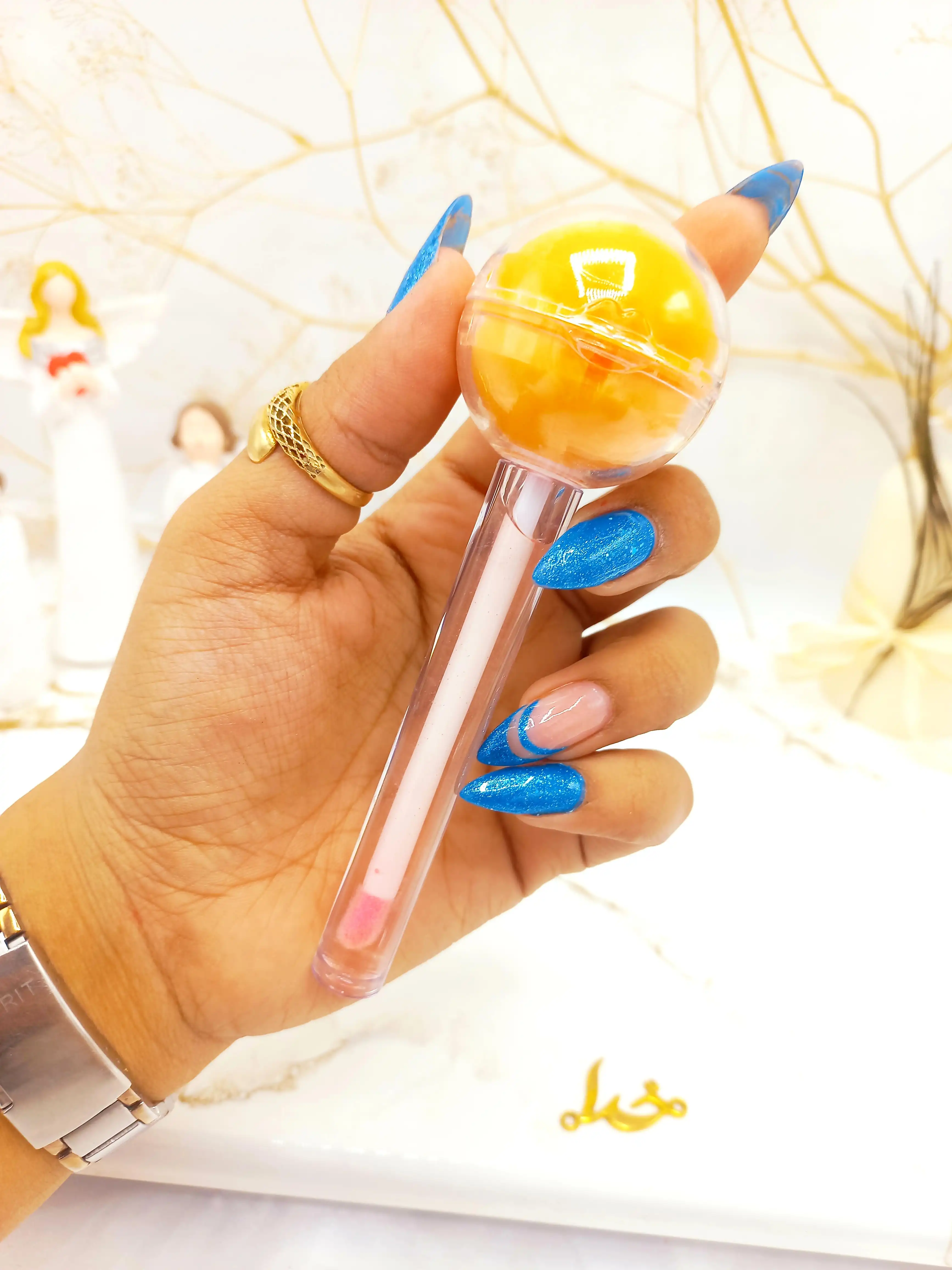 برق لب و بالم لب آبنباتی پرتقال هدا بیوتی استوری HUDA BEAUTY STORY