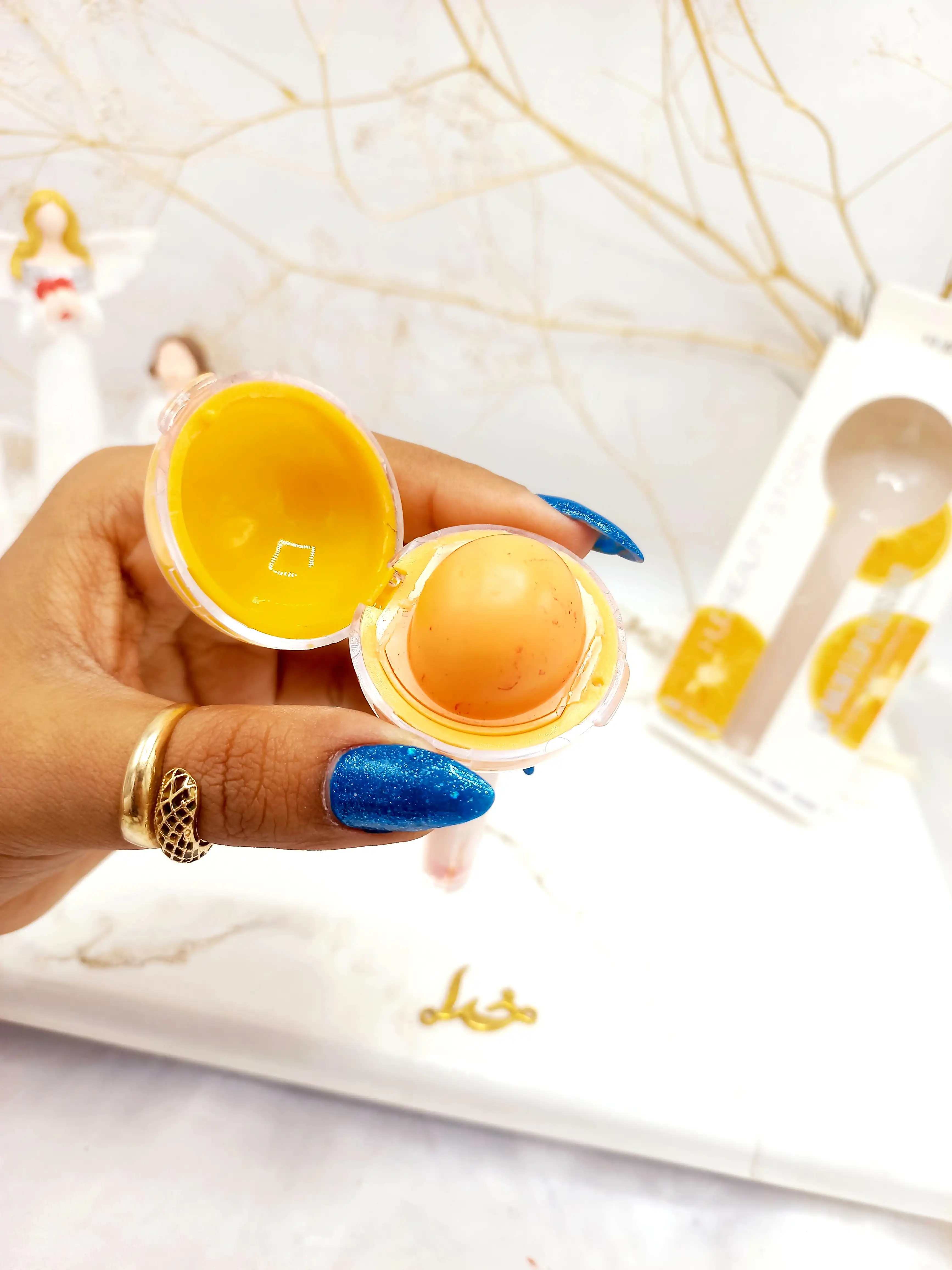 برق لب و بالم لب آبنباتی پرتقال هدا بیوتی استوری HUDA BEAUTY STORY